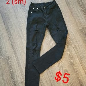 Distressed black skinny jeans